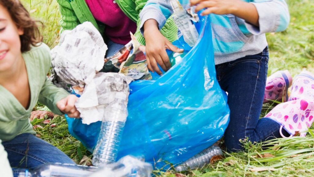Image of children picking up trash